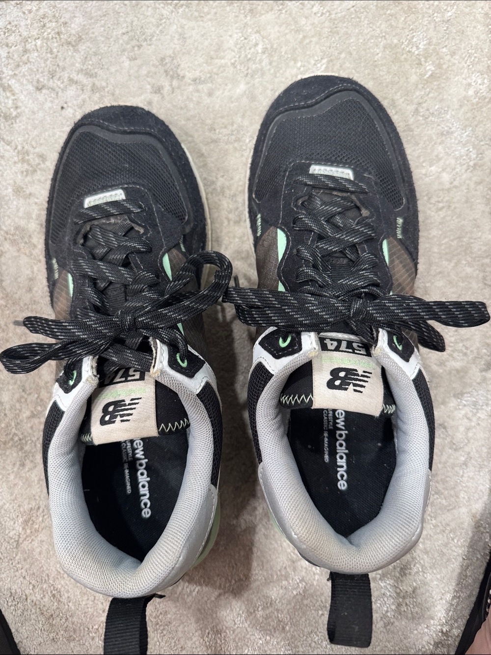 New Balance women’s Black & Mint 574 Retro Sneakers
